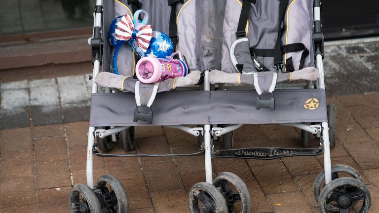 A baby stroller and water bottle are left behind on Central Avenue near the scene of the mass shooting at the 4th of July parade route in the affluent Chicago suburb of Highland Park, Illinois, USA July 4, 2022. REUTERS / Max Herman