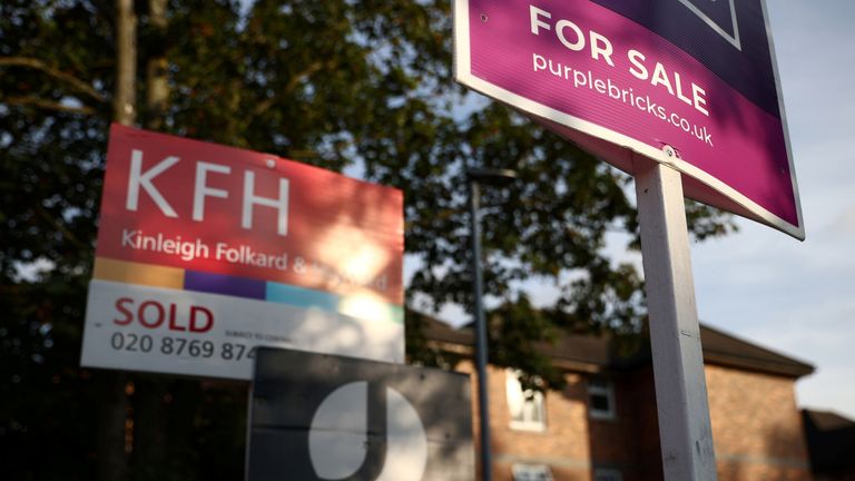 Property estate agent sales and letting signs are seen attached to railings outside an apartment building in south London, Britain, September 23, 2021.