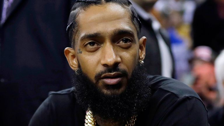 Rapper Nipsey Hussle attends an NBA basketball game between the Golden State Warriors and the Milwaukee Bucks in Oakland, Calif., March 29, 2018. Pic: AP