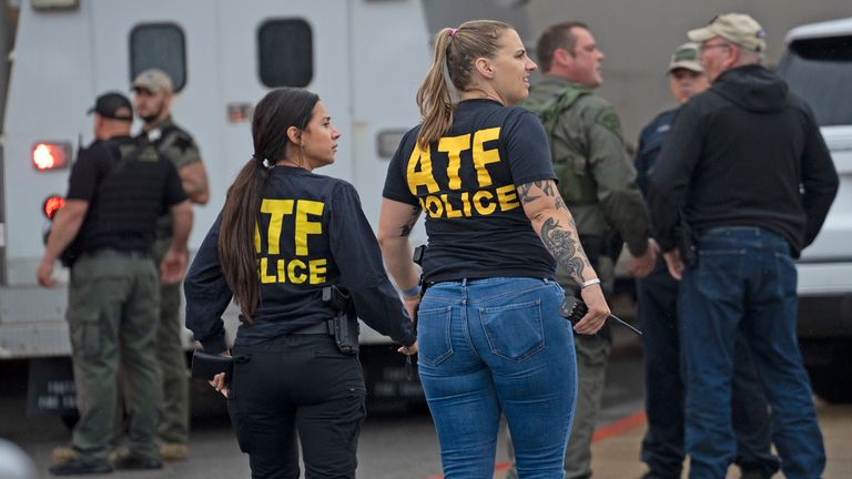 ATF officers arrive on the scene following a deadly shooting on Sunday, July 17, 2022, at Greenwood Park Mall, in Greenwood, Ind.  (Kelly Wilkinson / The Indianapolis Star via AP)