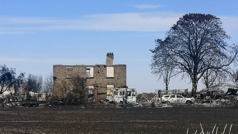 Blown-out windows, walls cracked in extreme heat: Images show rubble as cordon lifted in Wennington – but some residents are still away on holiday and haven’t seen remains | UK News