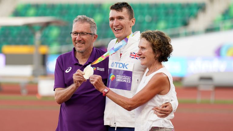 Geoff and Susan Wightman pose with their son Gold medalist Jake Wightman after the men&#39;s 1500-meter final run at the World Athletics Championships on Tuesday, July 19, 2022, in Eugene, Ore. (AP Photo/Ashley Landis)