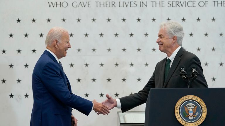 President Joe Biden, left, shakes hands with Central Intelligence Agency Director William Burns, right, as he is introduced to speak at the CIA headquarters in Langley, Va., Friday, July 8, 2022. Biden thanked the CIA workforce and commemorated the agency&#39;s achievements over the 75 years since its founding. (AP Photo/Susan Walsh)
