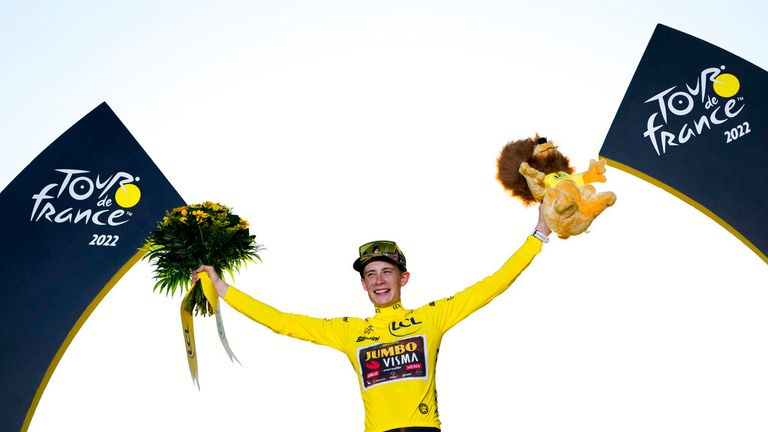Tour de France winner Denmark&#39;s Jonas Vingegaard, wearing the overall leader&#39;s yellow jersey, celebrates on the podium after the twenty-first stage of the Tour de France cycling race over 116 kilometers (72 miles) with start in Paris la Defense Arena and finish on the Champs Elysees in Paris, France, Sunday, July 24, 2022. (AP Photo/Thibault Camus)
