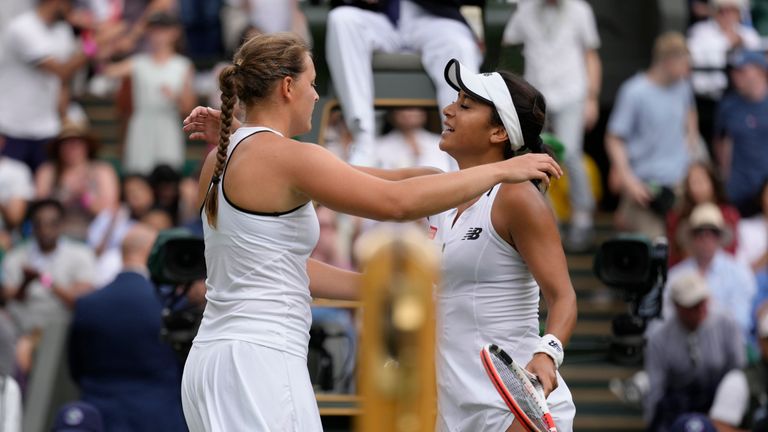 Germany&#39;s Jule Niemeier hugs Britain&#39;s Heather Watson after defeating her in a women&#39;s fourth round singles match on day seven of the Wimbledon tennis championships in London, Sunday, July 3, 2022. (AP Photo/Kirsty Wigglesworth)