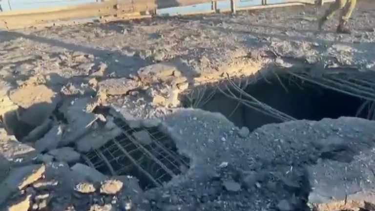 Holes in Kherson bridge after strike