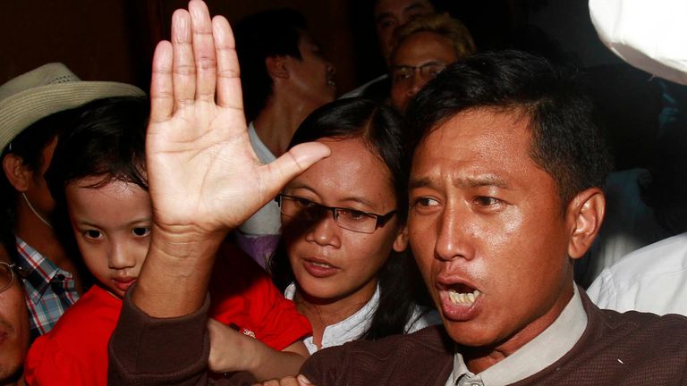 FILE - Kyaw Min Yu, a pro-democracy activist talks to journalists as he arrives at Yangon airport welcomed by his wife Nilar Thein, background, also an activist and his daughter after being released from a prison on Jan. 13, 2012, in Yangon.  A Myanmar military spokesperson announced on June 3, 2022, that Kyaw Min Yu, a veteran pro-democracy activist better known as Ko Jimmy, and Phyo Zeya Thaw, a former lawmaker from ousted leader Aung San Suu Kyi...s party, would be executed for violating the country...s counterterrorism law. (AP Photo/File)