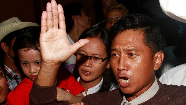 FILE - Kyaw Min Yu, a pro-democracy activist speaks to journalists as he arrives at Yangon airport to be greeted by his wife Nilar Thein, the foundation, also an activist, and his daughter after released from prison on January 13, 2012, in Yangon.  A Myanmar military spokesman announced on June 3, 2022, that Kyaw Min Yu, a veteran democracy activist known as Ko Jimmy, and Phyo Zeya Thaw, a former lawmaker here of Aung San Suu Kyi's party ... deposed, will be put to death for violating the country's anti-terrorism law.  (Photo/AP File)