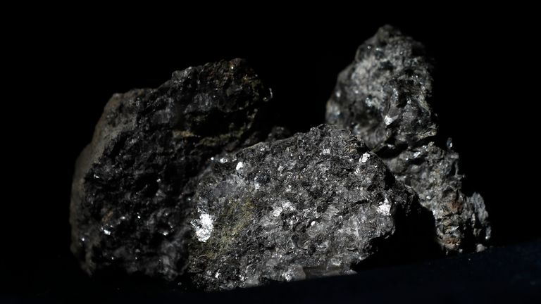 FILE - Pieces of lithium sparkle in an ore sample in Prague, Czech Republic, on Tuesday, March 28, 2017.  
Pic:AP