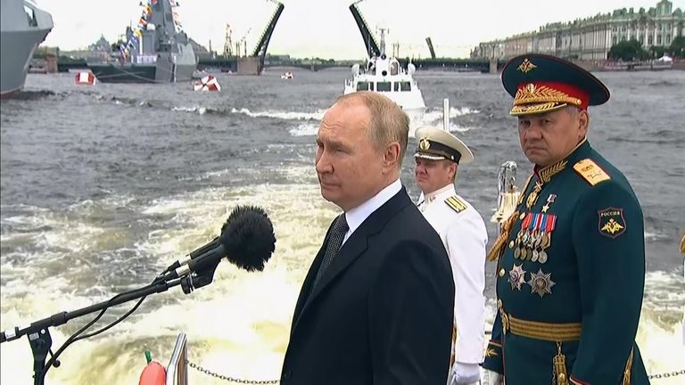 Vladimir Putin takes part in a naval parade as part of Russia's Navy Day 