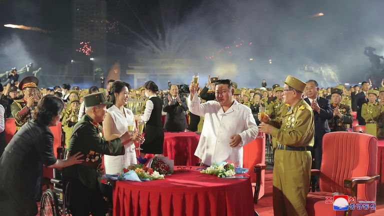 In this photo provided by the North Korean government, North Korean leader Kim Jong Un, center, and his wife Ri Sol Ju attend a ceremony to mark the 69th anniversary of the signing of the ceasefire armistice that ends the fighting in the Korean War, in Pyongyang, North Korea Wednesday, July 27, 2022. Independent journalists were not given access to cover the event depicted in this image distributed by the North Korean government. The content of this image is as provided and cannot be independently verified. Korean language watermark on image as provided by source reads: &#34;KCNA&#34; which is the abbreviation for Korean Central News Agency. (Korean Central News Agency/Korea News Service via AP)