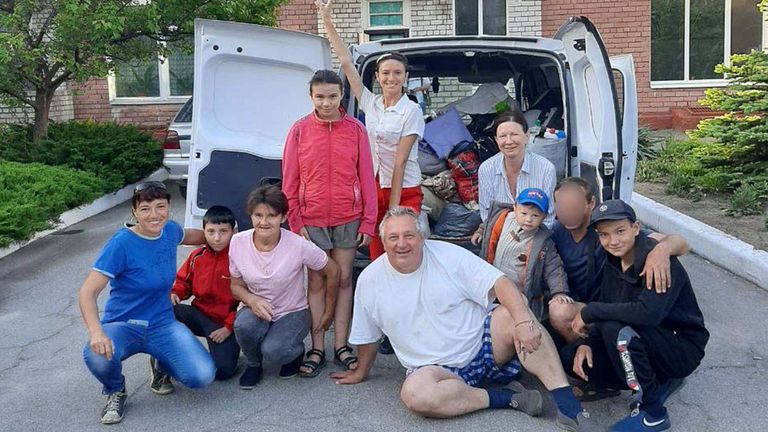 Aleksey (front center) and the nine people he was transporting.  The face of a veteran of the Ukrainian armed forces is blurred to protect his identity. 