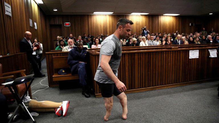 Oscar Pistorius demonstrating to the court how he walks without his prosthetic legs 