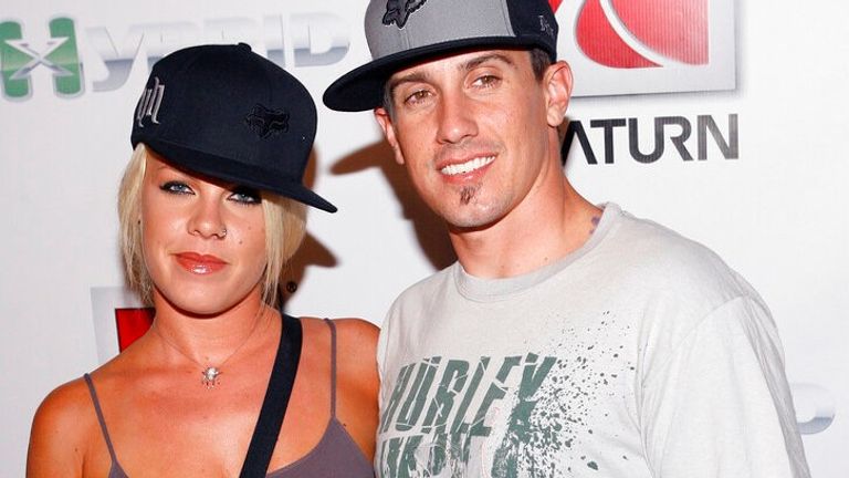 Musician Pink, left, and her husband, Motocross racer Carey Hart, arrive at the "Saturn Kick Off to X-Games 12" party in the Hollywood section of Los Angeles on Wednesday, Aug. 2, 2006. (AP Photo/Matt Sayles)


