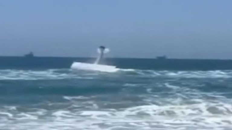 A beachgoer captured the moment a small plane crashed into the water off Huntington Beach.