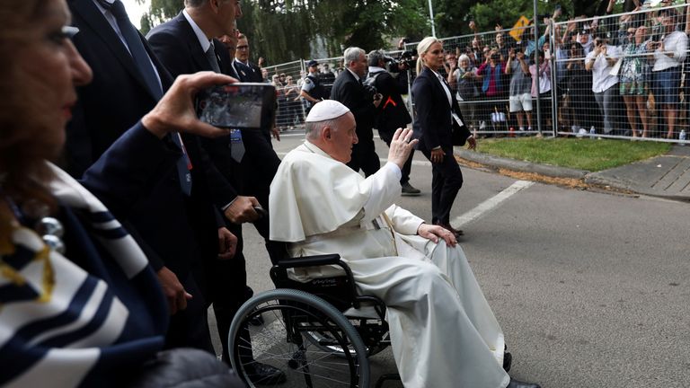Pope Francis waves as he leaves after a meeting with indigenous peoples and members of the Parish Community of Sacred Heart in Edmonton, Alberta, Canada