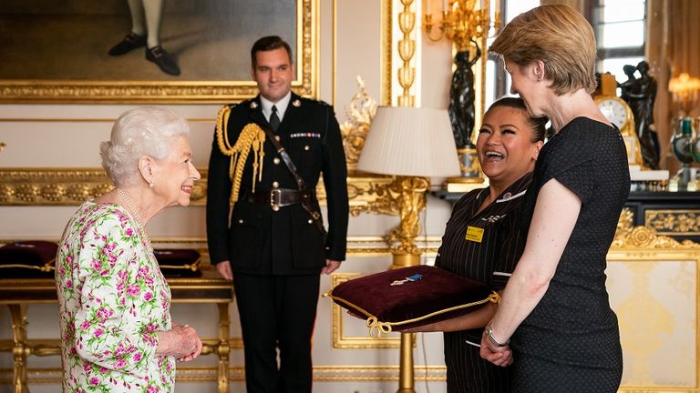 Queen jokes with nurses as she awards NHS the George Cross