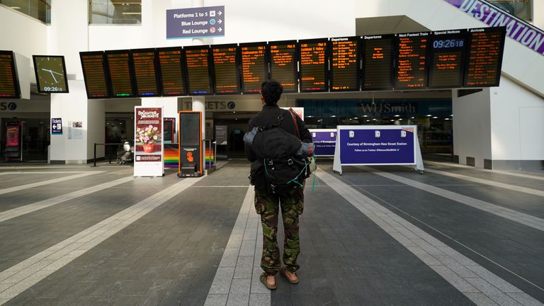 A passenger looks at a bulletin board at Birmingham New Street station, as members of the Rail, Maritime and Transport (RMT) union join a new strike over jobs, wages and working conditions.  Photo date: Wednesday, July 27, 2022.