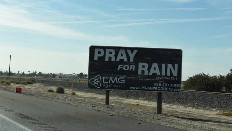 A billboard reading "pray for rain" stands on the highway near Teviston, California, U.S., October 22, 2021. Picture taken on October 22, 2021. REUTERS/Stephanie Keith