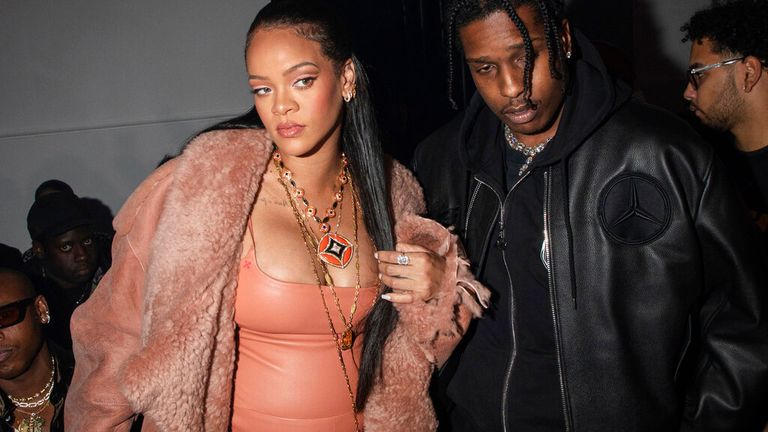 Rihanna, left, and ASAP Rocky arrive for the Off-White Ready To Wear Fall/Winter 2022-2023 fashion collection, unveiled during the Fashion Week in Paris, Monday, Feb. 28, 2022. (Photo by Vianney Le Caer/Invision/AP)