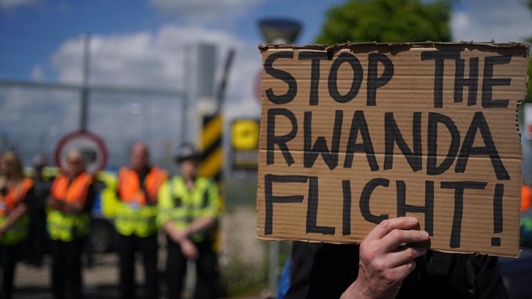 Demonstrators at a removal centre at Gatwick protest against plans to send migrants to Rwanda.

