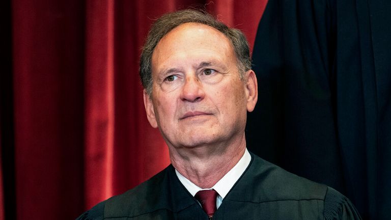 FILE - Associate Justice Samuel Alito sits during a group photo at the Supreme Court in Washington, Friday, April 23, 2021. The Supreme Court has ended constitutional protections for abortion that had been in place nearly 50 years, a decision by its conservative majority to overturn the court&#39;s landmark abortion cases. In the final opinion, Alito wrote that the court ...cannot allow our decisions to be affected by any extraneous influences such as concern about the public...s reaction to our work.... (Erin Schaff/The New York Times via AP, Pool)