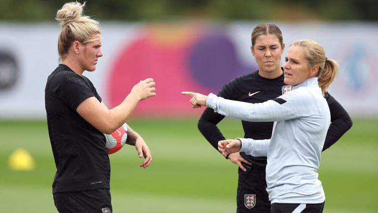 England manager Sarina Wiegman (R)  during a training session