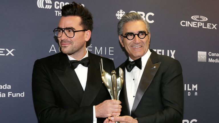 Daniel and Eugene Levy hold the award for best comedy series backstage at the 7th annual Canadian Screen Awards in Toronto, Canada