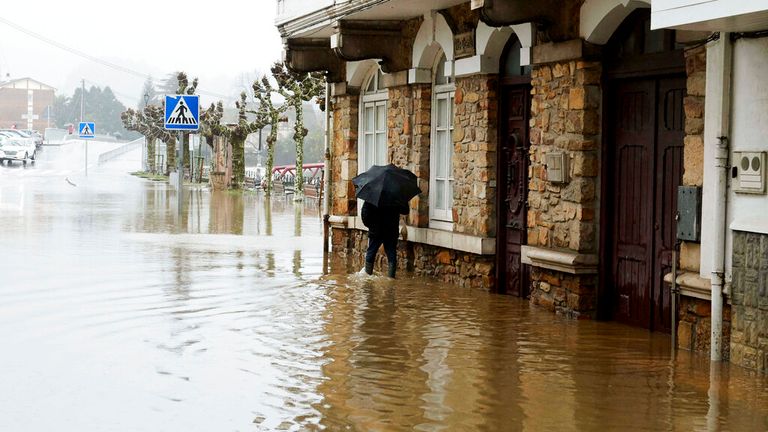 A man walks along a flooded road due to heavy rains on November 29, 2021, in Ampuero, Cantabria, Spain. The Arwen squall has left constant rain for days and heavy snowfall in the north of the Peninsula. Cantabria, one of the most affected regions, has recorded hundreds of emergency calls, flooding in homes, cancellation of classes in some municipalities and overflowing of several rivers. The region continues this Monday in yellow warning for rain and coastal. In particular, there is yellow alert