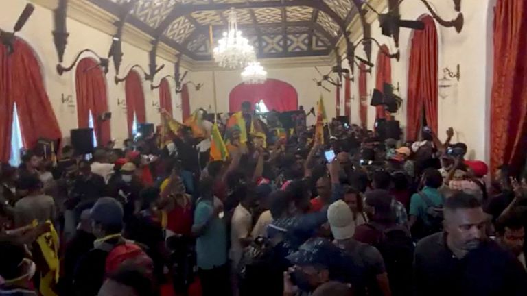 Demonstrators pictured inside President Gotabaya Rajapaksa's house after he fled. Pic: Reuters 