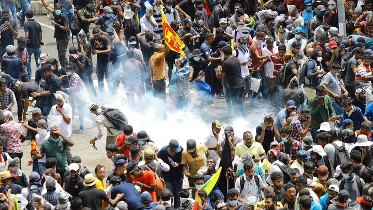 A tear gas shell fired by police lands in the crowd of protestors in Colombo. Pic: AP