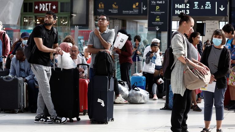 Travelers on the concourse wait for their train during a nationwide strike by France&#39;s national state-owned railway company SNCF workers, at Gare de Lyon train station in Paris, France, July 6, 2022. REUTERS/Benoit Tessier

