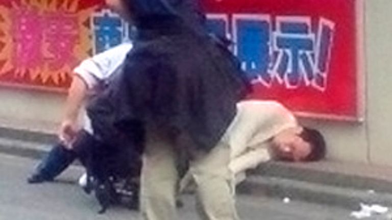 Tomohiro Kato, who killed seven people and injured dozens more, lies on the ground as he is detained by police in Tokyo's Akihabara district on June 8, 2008 in this photo taken by a walker. set of anonymous capture.  Kato, who said he was too tired of life, went on a rampage Sunday on a busy shopping street in Tokyo, stabbing passers-by in Akihabara, famous for its treats. discount electronics and maid cafes.  Photo taken June 8, 2008. QUALITY FROM REUTERS / Kyodo (JAPAN).  JAPAN OUT.  NO TRADE