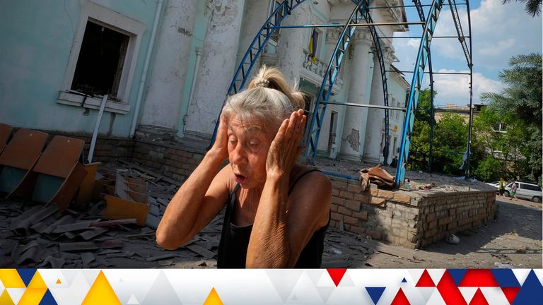 A woman covers her ears reacting to a Russian air raid in Lysychansk, Luhansk region, Ukraine, Thursday, June 16, 2022. (AP Photo/Efrem Lukatsky)