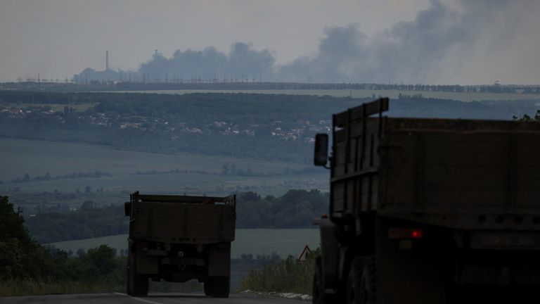 Vuhlehirsk&#39;s heat power plant burns in the distance after a shelling, amid Russia&#39;s attack on Ukraine, near the town of Svitlodarsk, Donetsk region, Ukraine July 13, 2022. REUTERS/Gleb Garanich