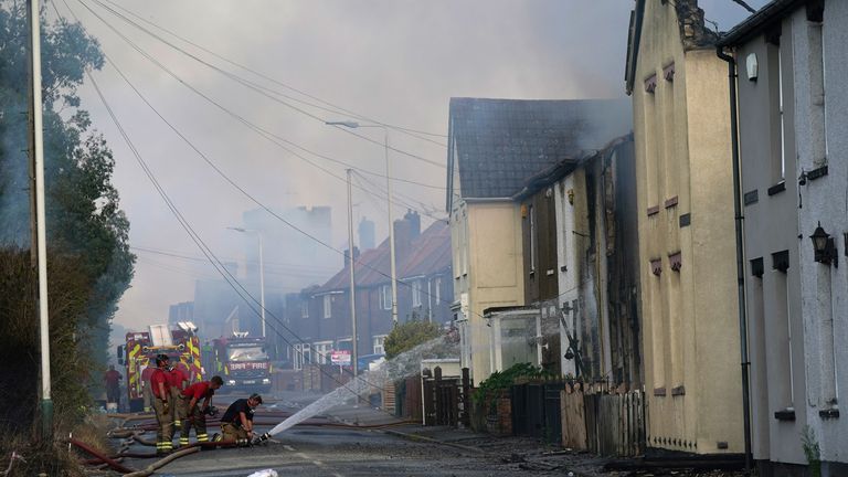 Firefighters tackle a blaze in the village of Wennington