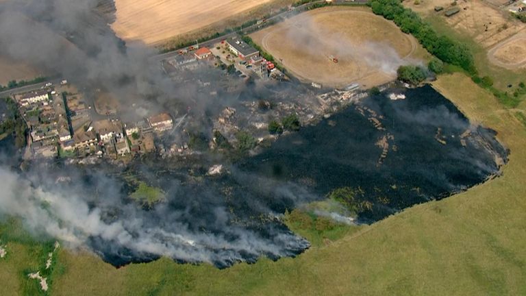 A number of buildings were engulfed by fire in Wennington, east London, during last summer&#39;s record-breaking heatwave 