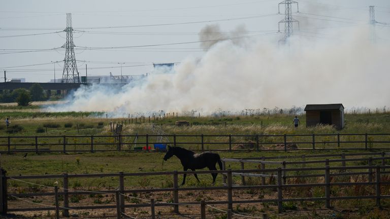 Smoke pours from a blaze in the village of Wennington, east London. London Fire Brigade has declared a major incident due to &#34;a huge surge&#34; in blazes across the capital amid the 40C heat. Picture date: Tuesday July 19, 2022.
