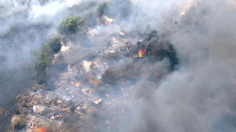 Several buildings were engulfed in flames in Wennington, east London.