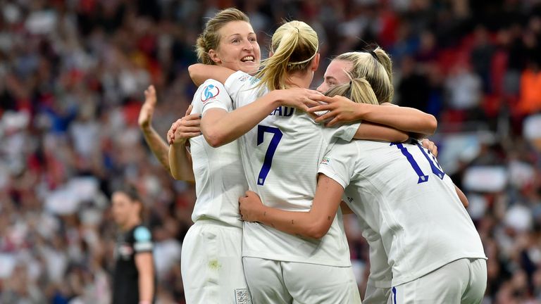 England&#39;s Beth Mead, center, celebrates with Ellen White, left, and Georgia Stanway after scoring the opening goal during the Women Euro 2022 soccer match between England and Austria at Old Trafford in Manchester, England, Wednesday, July 6, 2022. (AP Photo/Rui Vieira)