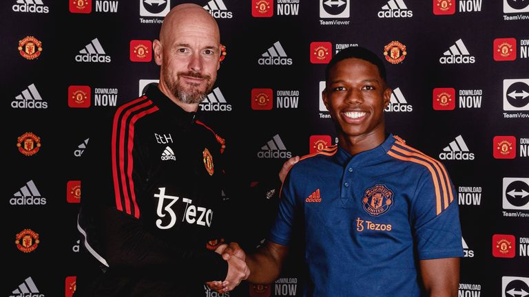 MANCHESTER, ENGLAND - JULY 05: (EXCLUSIVE COVERAGE) Tyrell Malacia of Manchester United poses with Manager Erik ten Hag after signing his contract with the club at Carrington Training Ground on July 05, 2022 in Manchester, England. (Photo by Ash Donelon/Manchester United via Getty Images)