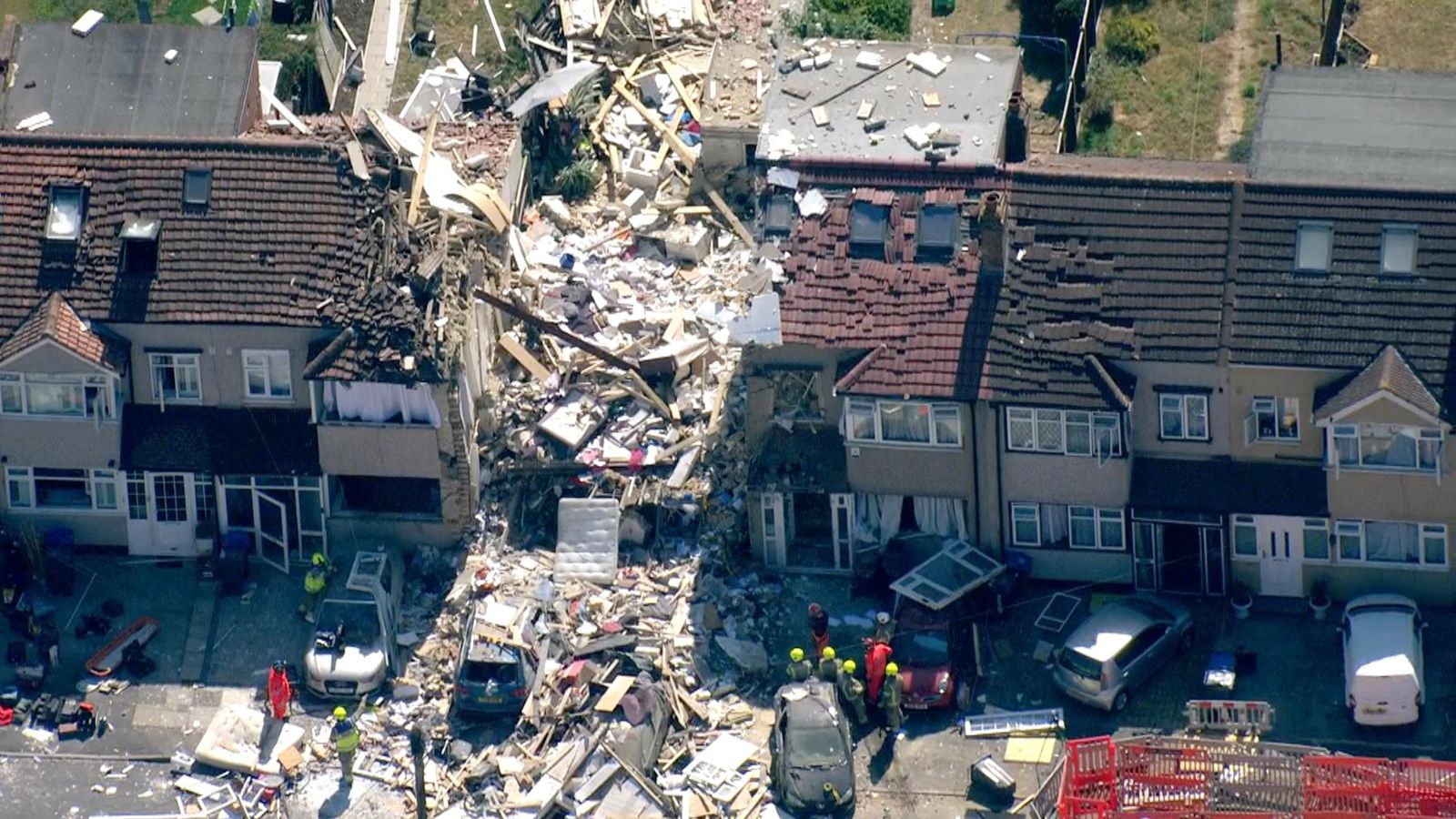 One person missing and four rescued as terraced house collapses after