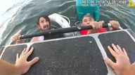 Men rescue from sinking boat off Boston. Pic: Boston Police