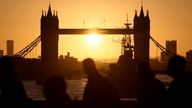 Commuters cross London Bridge at sunrise in London, Britain, February 23, 2022. REUTERS/Tom Nicholson
