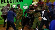 Members of opposition engage in a scuffle with the security officials as they block the IEBC chairman from making election result announcement at the IEBC National Tallying Centre at the Bomas of Kenya, in Nairobi, Kenya August 15, 2022. REUTERS/Monicah Mwangi