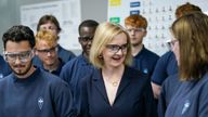 Britain&#39;s Conservative Party leadership candidate Liz Truss meets apprentices during a visit to the Reliance Precision engineering company ahead of a hustings event later, in Huddersfield, Britain August 9, 2022. Ian Forsyth/Pool via REUTERS
