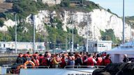 A group of people thought to be migrants are brought in to Dover, Kent, from a Border Force Vessel, following a small boat incident in the Channel. Picture date: Tuesday August 23, 2022.

