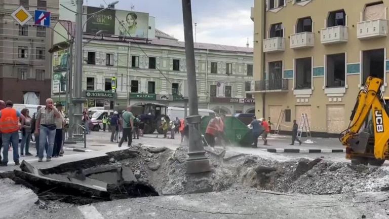 Missiles fired by Russian forces hit a residential district in Kharkiv according to the city Governor. In a video posted online people are seen crowding round the crater while people begin to sweep up the dust left behind.