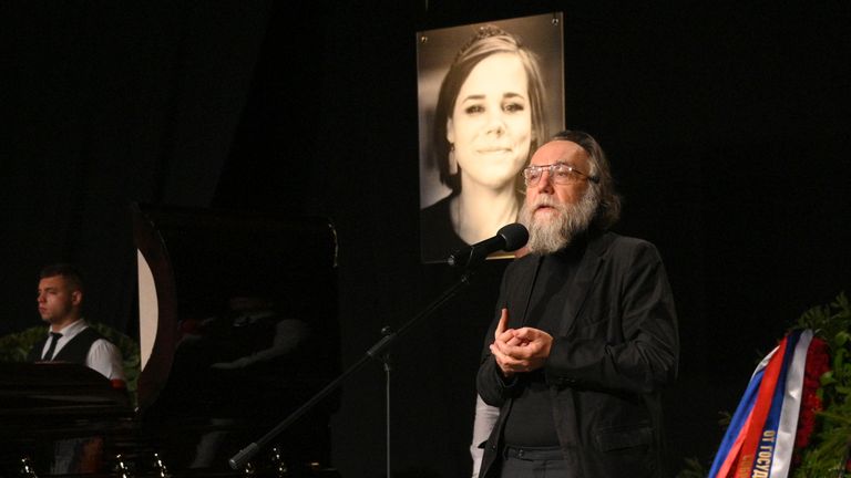 Philosopher Alexander Dugin speaks during the final farewell ceremony for his daughter Daria Dugina in Moscow, Russia, Tuesday, Aug. 23, 2022. Daria Dugina, a 29-year-old commentator with a nationalist Russian TV channel, died when a remotely controlled explosive device planted in her SUV blew up on Saturday night as she was driving on the outskirts of Moscow, ripping the vehicle apart and killing her on the spot, authorities said. (AP Photo/Dmitry Serebryakov)