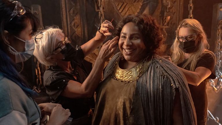 This image released by Amazon Studios shows Sophia Nomvete on the set of "The Lord of the Rings: The Rings of Power." (Amazon Studios via AP)